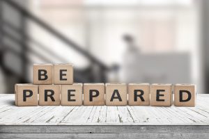 Be prepared phrase on wooden dices in a bright room on an old desk