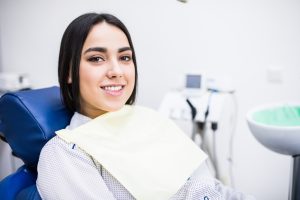 Overview of dental caries prevention.Woman at the dentist's chair during a dental procedure. Beautiful Woman smile close up. Healthy Smile. Beautiful Female Smile