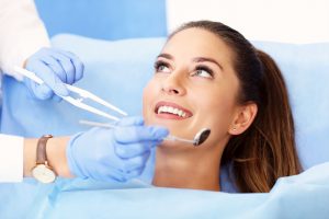 Picture of adult woman having a visit at the dentist's