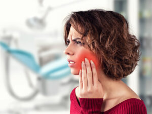 Girl with a painful tooth in a medical office