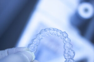 Invisible retainers dental straightener and aligner brackets used to straighten and align teeth in cosmetic dentistry.