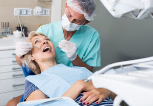 Male dentist with female patient during oral checkup in dentistry